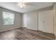 This bedroom features a ceiling fan, wood-look floors, and two closets at 1400 Gandy N Blvd # 1504, St Petersburg, FL 33702