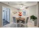 Dining area with a round table, seating for four, decorative accents, and a view into other rooms at 1400 Gandy N Blvd # 1504, St Petersburg, FL 33702