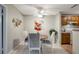 Cozy dining area with a round table, seating for four, and a stylish ceiling fan at 1400 Gandy N Blvd # 1504, St Petersburg, FL 33702