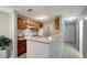 Functional kitchen with a breakfast bar, neutral countertops, and ample cabinet space for storage at 1400 Gandy N Blvd # 1504, St Petersburg, FL 33702