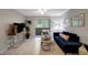 Inviting living room featuring natural light, tile floors, and a comfortable seating arrangement with stylish decor at 1400 Gandy N Blvd # 1504, St Petersburg, FL 33702