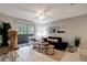 Bright living room boasts sliding glass doors to a balcony, tile floors, and neutral walls at 1400 Gandy N Blvd # 1504, St Petersburg, FL 33702