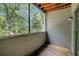 This screened-in patio features natural lighting and wooded views at 1400 Gandy N Blvd # 1504, St Petersburg, FL 33702