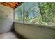 This screened-in patio features natural lighting and wooded views at 1400 Gandy N Blvd # 1504, St Petersburg, FL 33702