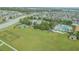 Aerial view of community amenities including pool, park, basketball and dog park surrounded by lovely single Gathering homes at 14614 Rannoch Moor Pl, Wimauma, FL 33598