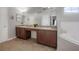 Bathroom featuring a double vanity, bathtub, and plenty of counter space at 14614 Rannoch Moor Pl, Wimauma, FL 33598