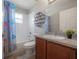 Bathroom with a tub/shower combination, and wood vanity at 14614 Rannoch Moor Pl, Wimauma, FL 33598