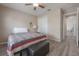 Comfortable bedroom featuring a quilt bed, a ceiling fan, and a spacious closet at 14614 Rannoch Moor Pl, Wimauma, FL 33598