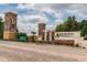 Ayersworth community entrance with stone pillars, a decorative fountain, and landscaping at 14614 Rannoch Moor Pl, Wimauma, FL 33598