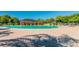 Large community pool with spacious deck, comfortable lounge chairs, and lush landscaping at 14614 Rannoch Moor Pl, Wimauma, FL 33598