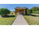 Charming gazebo with picnic table and view of the lake offering a relaxing outdoor space at 14614 Rannoch Moor Pl, Wimauma, FL 33598