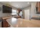 Well-lit kitchen with ample counter space and stainless steel appliances at 14614 Rannoch Moor Pl, Wimauma, FL 33598