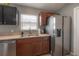 Well-appointed kitchen featuring stainless steel appliances, ample counter space and updated fixtures at 14614 Rannoch Moor Pl, Wimauma, FL 33598