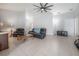 Comfortable living room featuring tile floors, high ceilings, and plenty of natural light at 14614 Rannoch Moor Pl, Wimauma, FL 33598