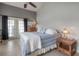 Serene bedroom with neutral colors, ceiling fan, and a cozy atmosphere at 14614 Rannoch Moor Pl, Wimauma, FL 33598