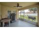 Relaxing enclosed patio featuring a ceiling fan and ample space for outdoor enjoyment at 14614 Rannoch Moor Pl, Wimauma, FL 33598