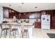 Kitchen with breakfast bar, granite countertops, and stainless-steel appliances at 15301 Morning Dr, Lutz, FL 33559