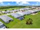 Scenic aerial view of home with pool, landscaping, and golf course in a well-maintained community at 15817 San Lazzaro Ave, Bradenton, FL 34211