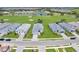 An aerial view showing the neighborhood with attractive homes and landscaping near the golf course at 15817 San Lazzaro Ave, Bradenton, FL 34211
