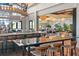 Stylish bar area with modern lighting, seating, and a clear view of the adjacent dining room at 15817 San Lazzaro Ave, Bradenton, FL 34211