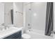 This bathroom features a shower and tub combo, a vanity, and tile flooring at 15817 San Lazzaro Ave, Bradenton, FL 34211