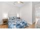Bright bedroom with modern ceiling fan and comfortable bed with a beautiful design at 15817 San Lazzaro Ave, Bradenton, FL 34211