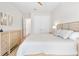 This bedroom features a comfortable bed, dresser, and art for a relaxing and inviting space at 15817 San Lazzaro Ave, Bradenton, FL 34211