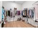 Spacious walk-in closet with hardwood flooring and wire shelving, ideal for storage at 15817 San Lazzaro Ave, Bradenton, FL 34211