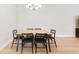 This dining area features a modern chandelier and table with seating for six at 15817 San Lazzaro Ave, Bradenton, FL 34211