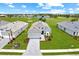 Beautiful single-Gathering home featuring well-manicured lawn, brick paver driveway, and golf course view at 15817 San Lazzaro Ave, Bradenton, FL 34211
