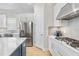Well-equipped kitchen with stainless steel appliances, white cabinets, and gas range at 15817 San Lazzaro Ave, Bradenton, FL 34211