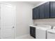 This well-equipped laundry room has overhead cabinets and a countertop sink for added convenience at 15817 San Lazzaro Ave, Bradenton, FL 34211
