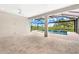 Outdoor patio with a marble tile floor overlooks the pool with an outdoor view of the property and landscaping at 15817 San Lazzaro Ave, Bradenton, FL 34211