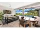 Outdoor patio and living area with ceiling fan and furniture that overlooks the pool and property at 15817 San Lazzaro Ave, Bradenton, FL 34211