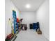 The large storage room with an epoxy floor offers ample space for storing household items at 15817 San Lazzaro Ave, Bradenton, FL 34211