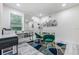 Bright room featuring ample desk space and modern flooring at 1608 E Linden Ave, Tampa, FL 33604