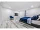 Spacious bedroom with plenty of natural light and neutral modern floors at 1608 E Linden Ave, Tampa, FL 33604