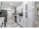 Bright kitchen with white cabinets, stainless steel appliances, and plenty of storage space at 1608 E Linden Ave, Tampa, FL 33604