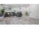 Inviting living room with wood floors, two sofas, a rug, and modern decor at 1608 E Linden Ave, Tampa, FL 33604