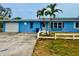 Charming single-story home with a well-maintained yard and a one car garage at 17595 1St E St, Redington Shores, FL 33708
