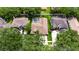 Aerial view of a home with a screened pool and well-maintained landscaping at 17711 Hampshire Oak Dr, Tampa, FL 33647