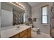 Bright bathroom featuring vanity, toilet, and shower/tub with stylish curtain at 17711 Hampshire Oak Dr, Tampa, FL 33647