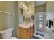 Bathroom featuring a single sink vanity, with an outdoor access to the pool area at 17711 Hampshire Oak Dr, Tampa, FL 33647