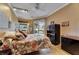Bedroom featuring ceiling fan, closet and outdoor access to the pool at 17711 Hampshire Oak Dr, Tampa, FL 33647