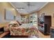 Bedroom featuring ceiling fan, closet and outdoor access to the pool at 17711 Hampshire Oak Dr, Tampa, FL 33647