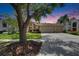 Charming home featuring a well-maintained lawn and a spacious three-car garage at 17711 Hampshire Oak Dr, Tampa, FL 33647