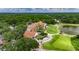 Stunning aerial view of the golf course and clubhouse at 17711 Hampshire Oak Dr, Tampa, FL 33647