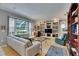 Spacious living room with built-in shelving and a large window providing plenty of natural light at 17711 Hampshire Oak Dr, Tampa, FL 33647