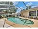 Private screened pool with steps, surrounded by a spacious deck, and landscaped for outdoor enjoyment and relaxation at 17711 Hampshire Oak Dr, Tampa, FL 33647