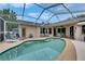 Backyard pool area featuring ample space, a screened enclosure, and a relaxing atmosphere for outdoor enjoyment and entertaining at 17711 Hampshire Oak Dr, Tampa, FL 33647